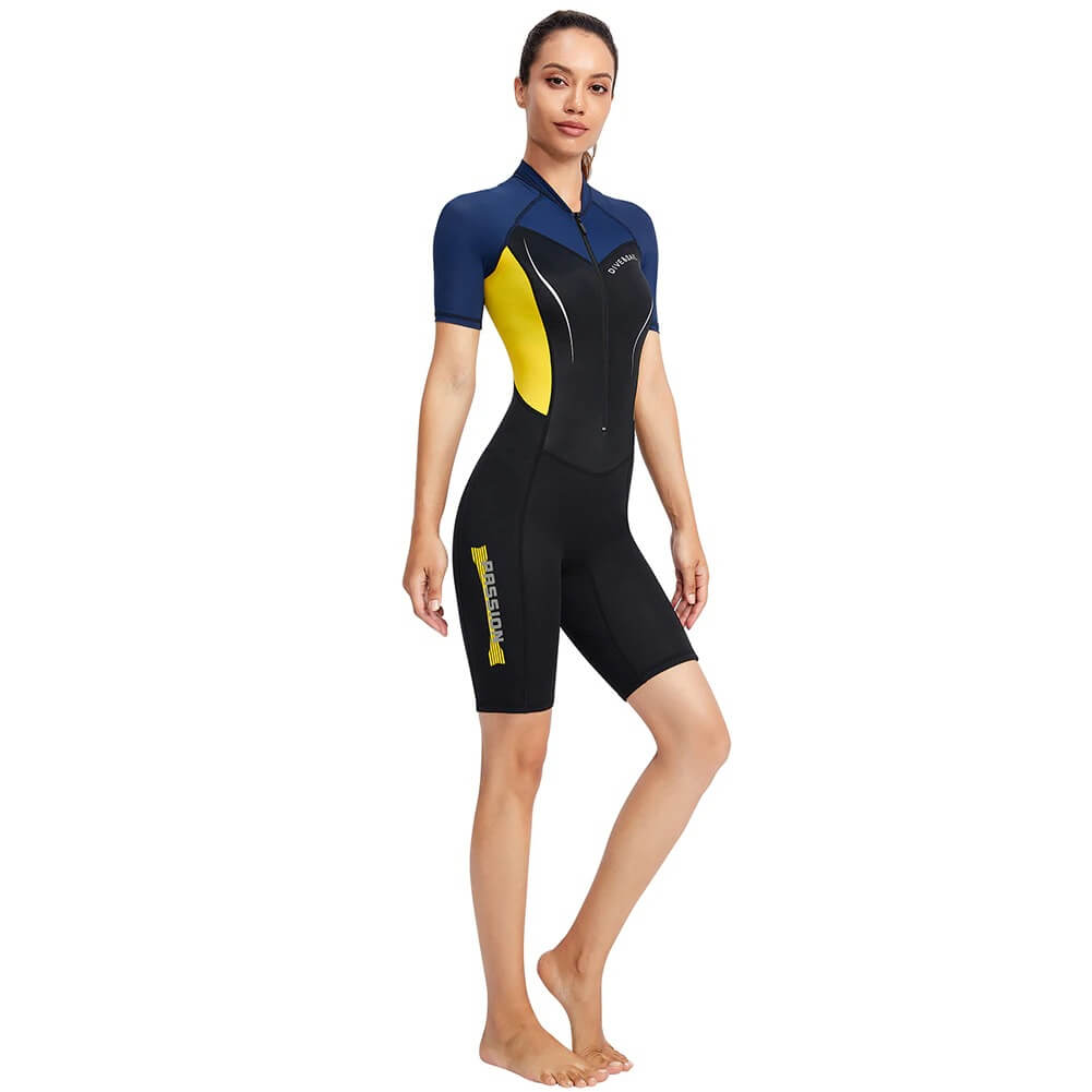 Woman wearing a Women's 1.5mm Neoprene Wetsuit for Surfing and Diving, SF0577, black and blue with short sleeves, standing confidently.